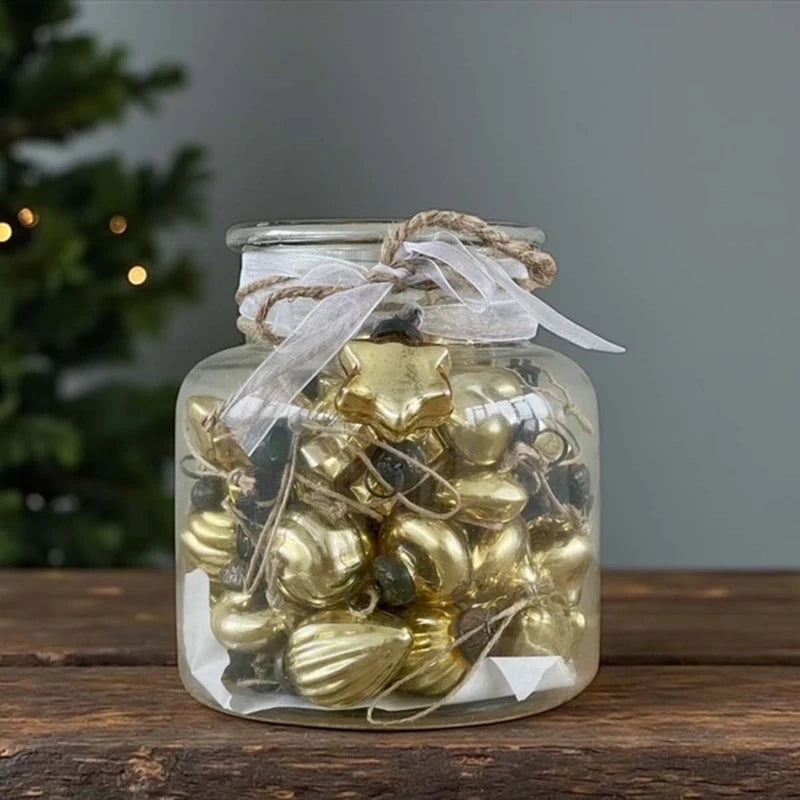 48 mini gold baubles in glass vase